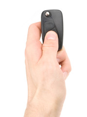 Hand holding car keys isolated on white background