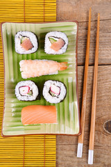 Sushi set on wooden background