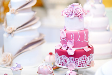 Fototapeta na wymiar White wedding cake decorated with sugar flowers