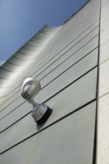 Halogen metal reflector on modern building grey wall