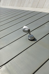 Halogen metal reflector on modern building grey wall