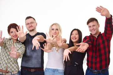 a group of young people, students stand together, show the palm