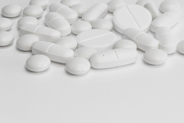 Medicine - many pills / tablets - white