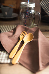 Wooden spoon and fork Placed on the napkin.