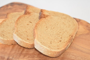 A slice of bread on a chopping board.