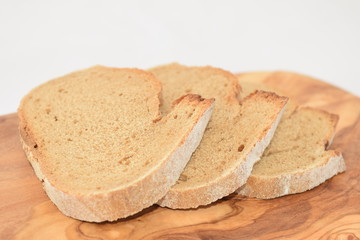 A slice of bread on a chopping board.