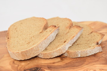 A slice of bread on a chopping board.