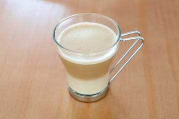 Tasty cup of coffee with milk