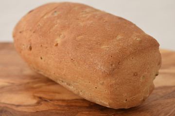 A slice of bread on a chopping board.