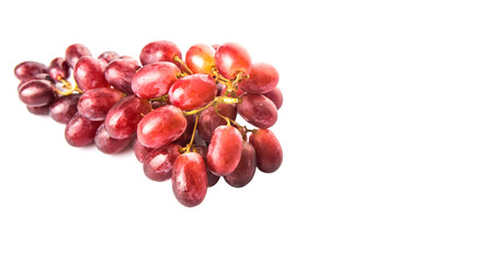 Red grapes over white background