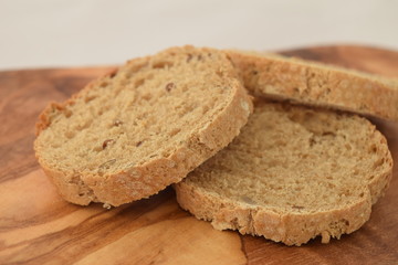 A slice of bread on a chopping board.