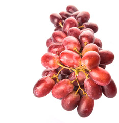 Red grapes over white background