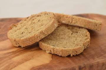 A slice of bread on a chopping board.