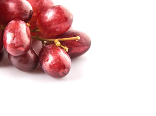 Fototapeta premium Red grapes over white background