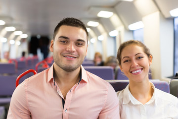 Young couple sitting in modern train