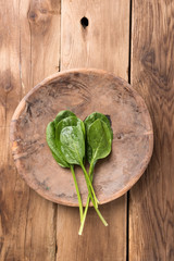 Raw Spinach in Wood Bowl