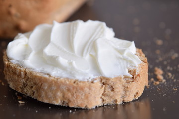 Slice of bread with cream cheese.