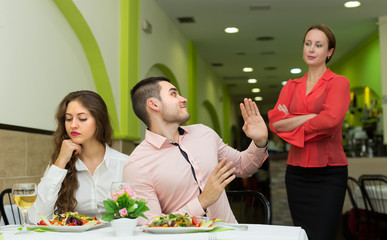 Unpleased couple in restaurant