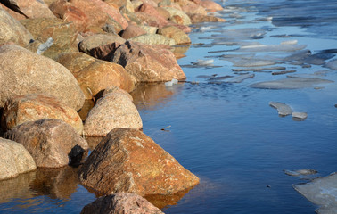 Frozen sea shore at the spring season