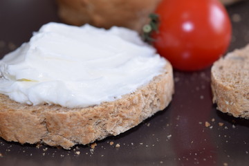 Slice of bread with cream cheese.