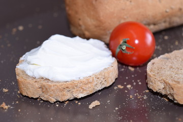 Slice of bread with cream cheese.