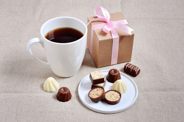 Chocolates a a cup of coffee