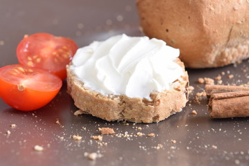 Slice of bread with cream cheese.