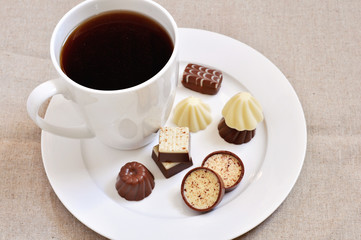 Chocolate sweets and a cup of coffee