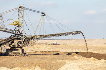 Fototapeta na wymiar Opencast brown coal mine. Giant excavator.