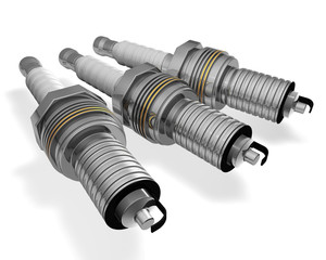 three  spark plugs isolated on white background