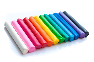 Fototapeta premium Rainbow colors plasticine play dough modeling clay isolated over