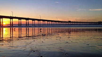 Naklejka na ściany i meble Sunset at Beach Pier, Ocean Beach, San Diego, California, USA
