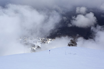 Hotels of Roza Khutor plateau in clouds.