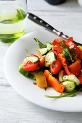 Salad with tomatoes, cucumbers and arugula