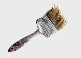 old dirty paintbrush on a white background