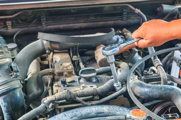 Engine mechanic working at auto repair shop