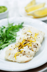 cod baked with lemon and spices with arugula and mashed green pe