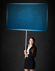 Businesswoman with blue board