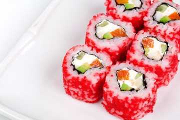 Sushi roll with salmon, crab, shrimps and caviar.