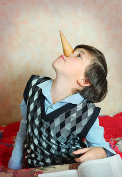 creative preteen handsome boy have an idea about pinoccio image