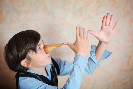 creative preteen handsome boy have an idea about pinoccio image