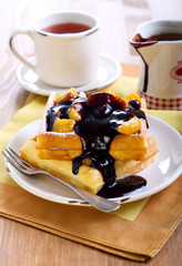 Waffles with fruits and chocolate sauce