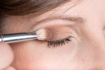 Naklejka premium Closeup of applying professional make up