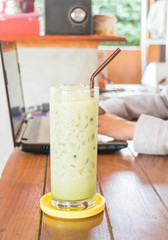 Glass of iced green tea latte