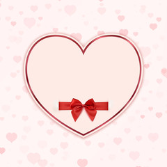 Paper heart with red ribbon and a bow.