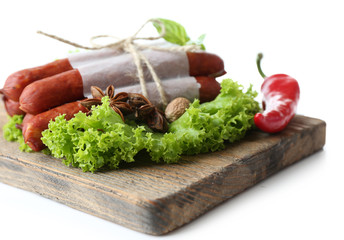 Smoked thin sausages  with lettuce salad leaves