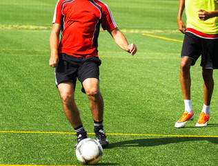 Young men are playing soccer