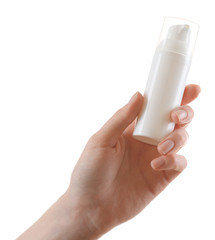 Female hand with cosmetics bottle isolated on white