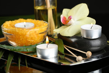 Beautiful spa composition with candles and orchid