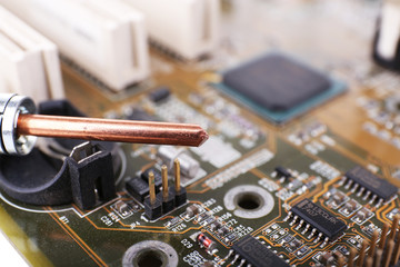 Repairing of computer motherboard, macro view